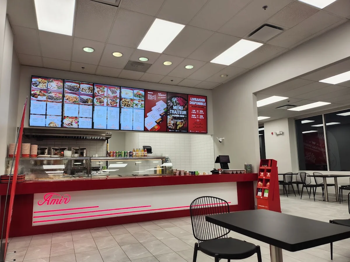 Amir restaurant interior with menu boards showing shawarma platters and prices, amir menu prices canada