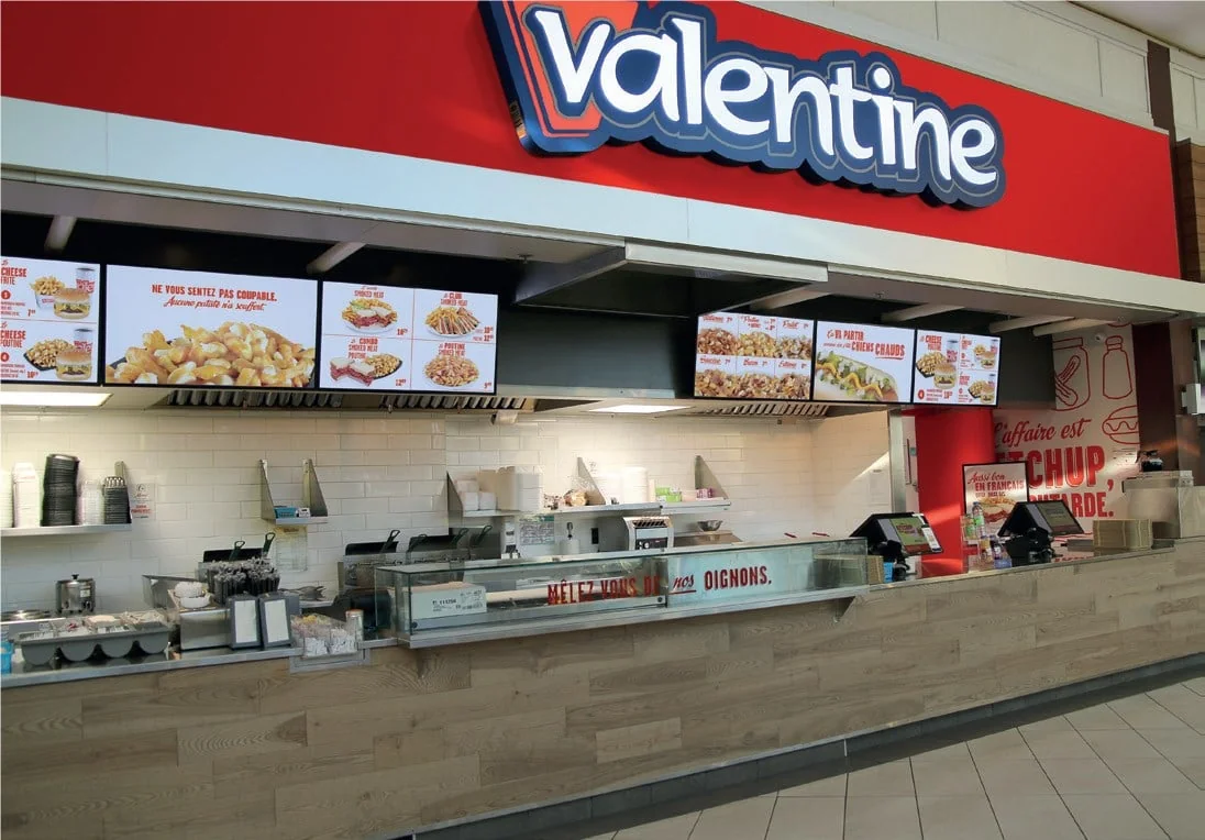 Valentine restaurant menu board showing poutine hot dogs and prices, valentine menu prices canada